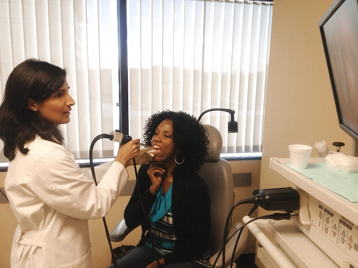 Dr. Reena Gupta performs videostroboscopy on singer, Baskerville Jones.